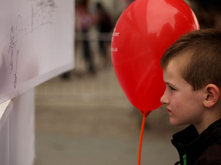 Boy with red balloon