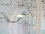 Sally painting on transparent screens
